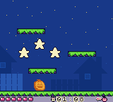 Three gold stars over the lit pumpkin after a clean level